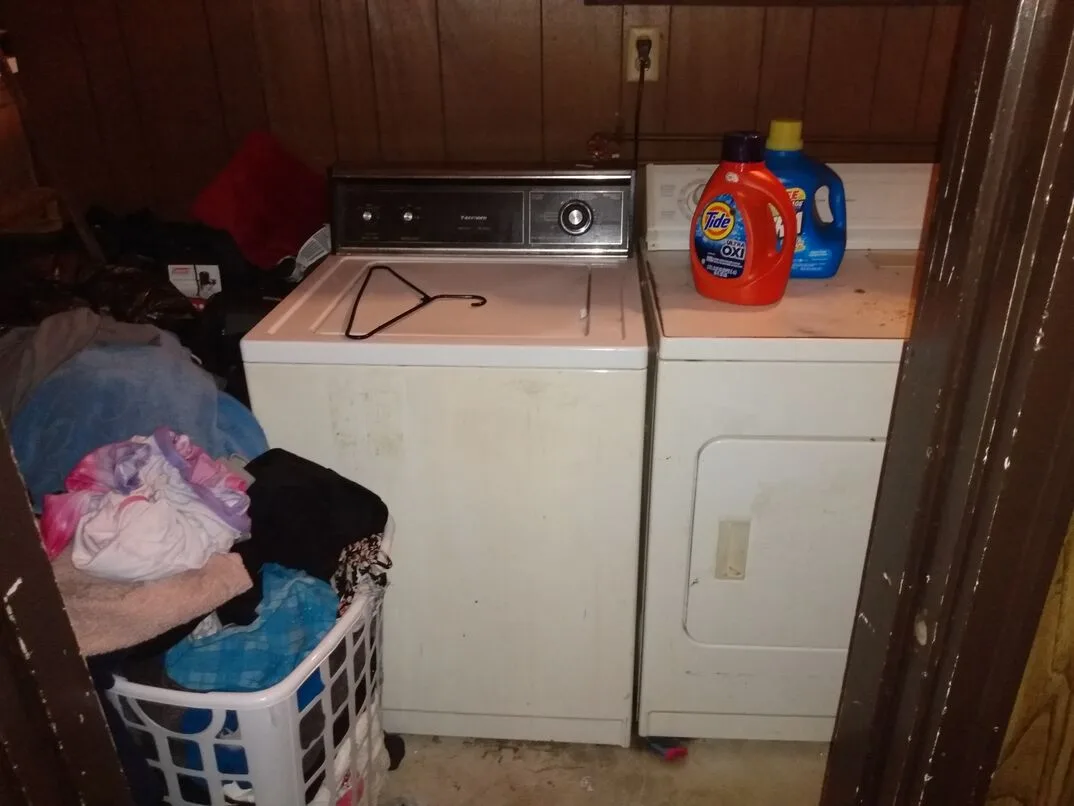 A washer and dryer side by side in a household laundry area.